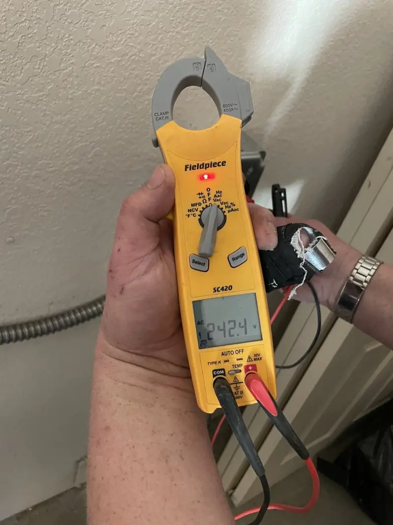 Voltage testing with clamp meter during Generator Installation in Orlando